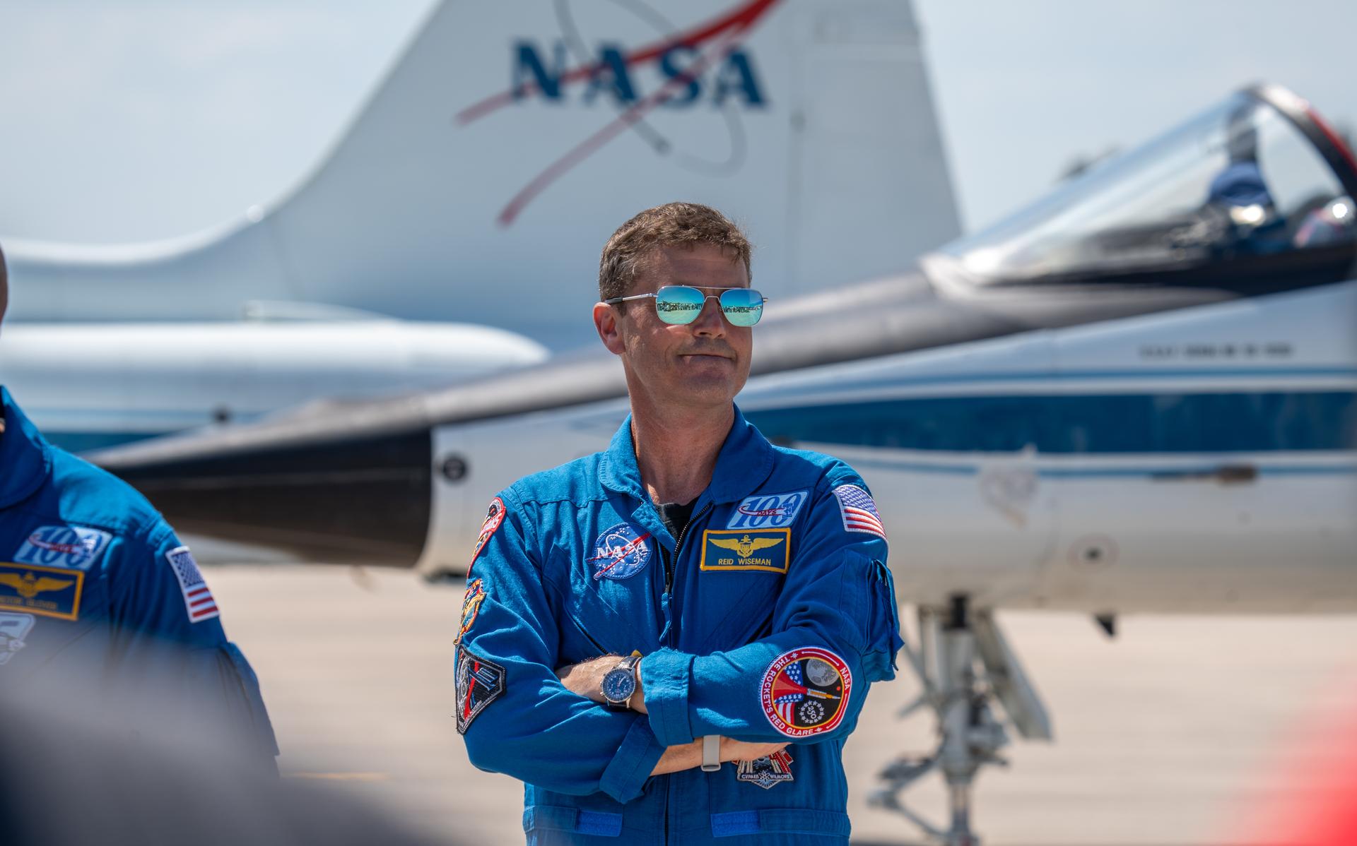These images show the moments shortly after the arrival of the Artemis II crew to NASA’s Kennedy Space Center on March 27, 2026 ahead of the launch. The four astronauts, Victor Glover, Reid Wiseman, Christina Koch, and Jeremy Hansen, arrived on a T38, which can be seen behind them. They took turns speaking to the crowd as they also announced the zero-gravity indicator they would be taking with them on their journey.